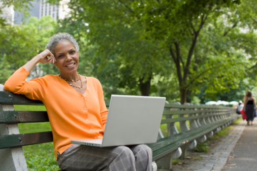 woman on laptop looking to meet single men over 40